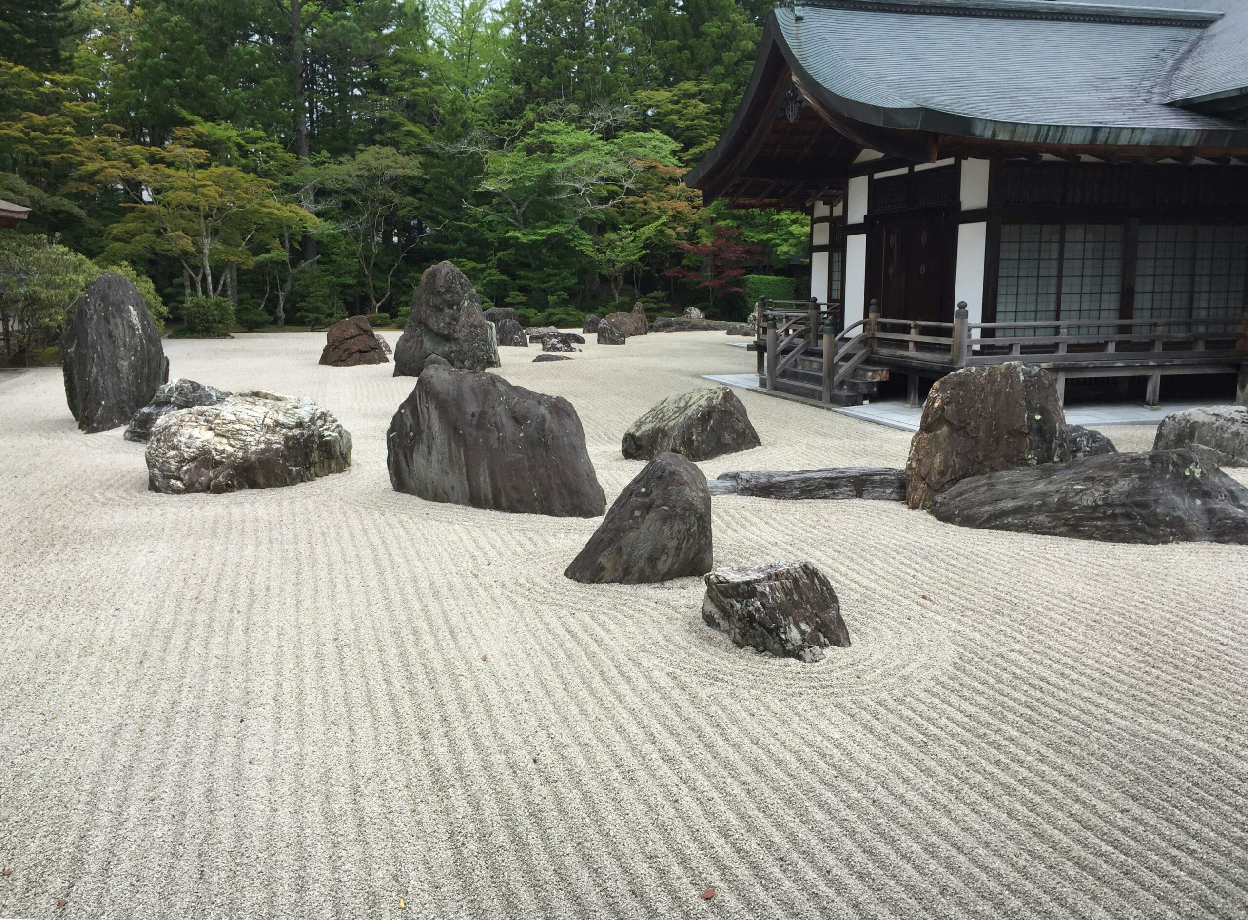 Japanese rock garden with temple building